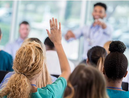 Adult student raising hand