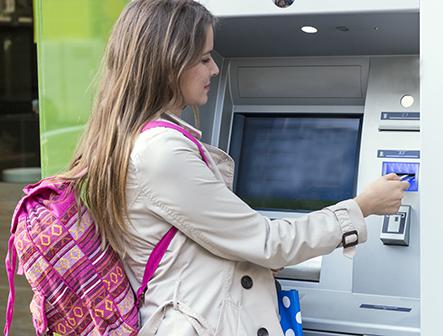 woman using atm machine